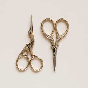 two sets of gold metal crochet scissors